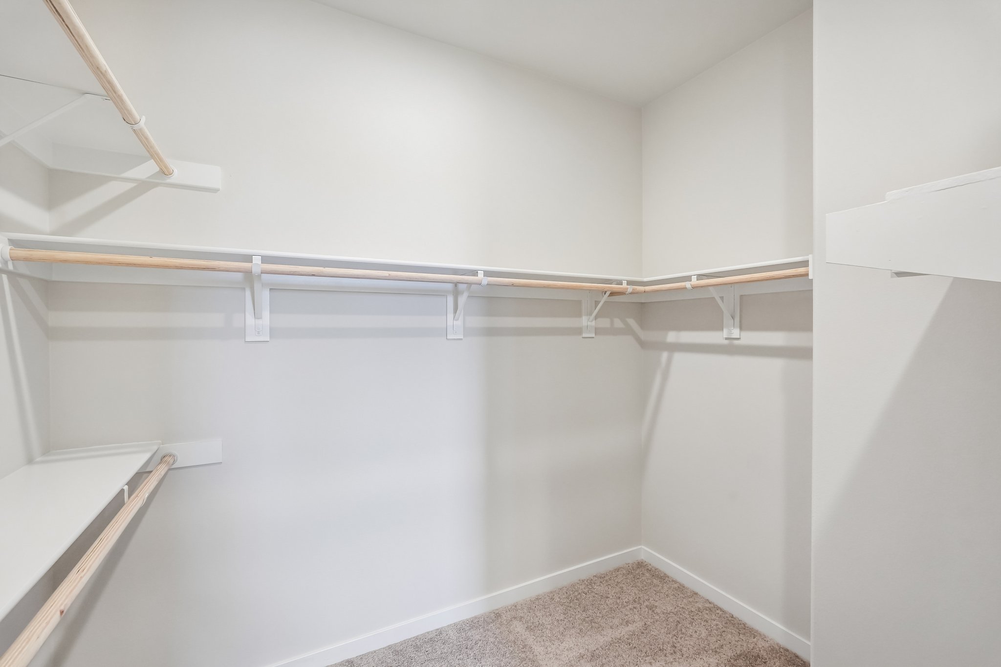 A white room with a metal railing.