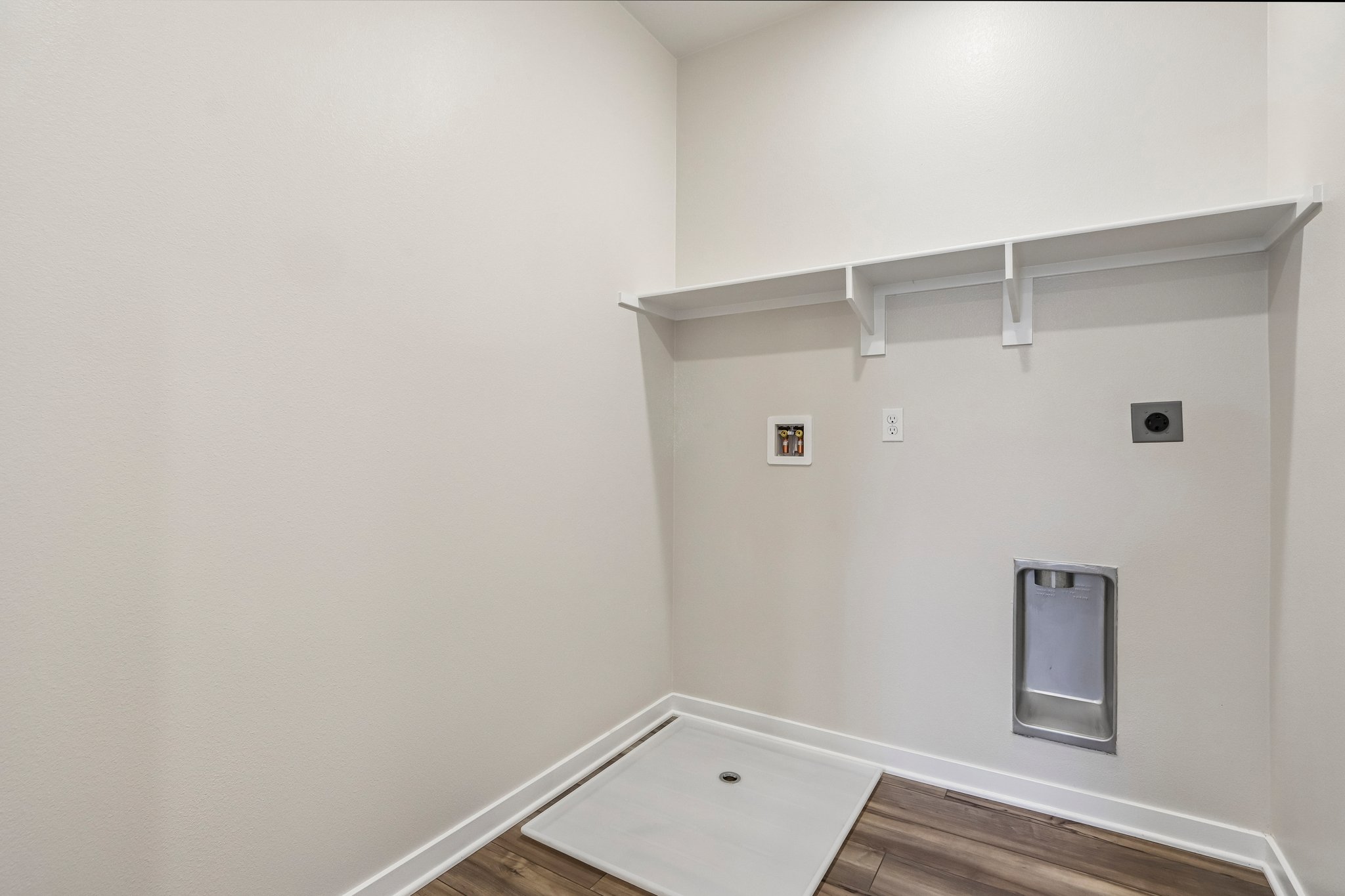 A white room with a white wall.
