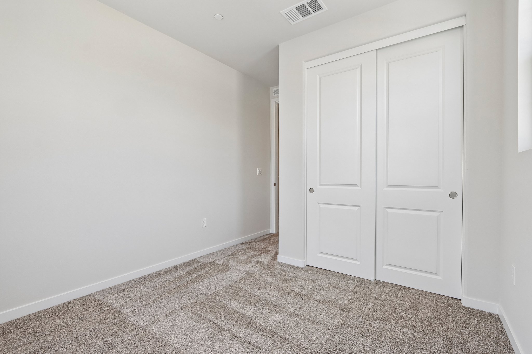 A room with white doors.