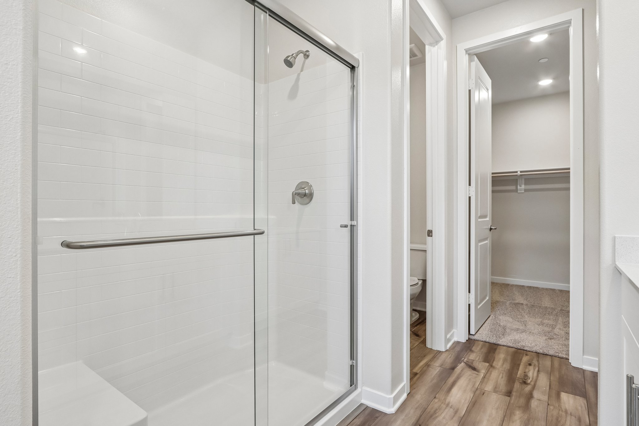 A bathroom with a shower unit.