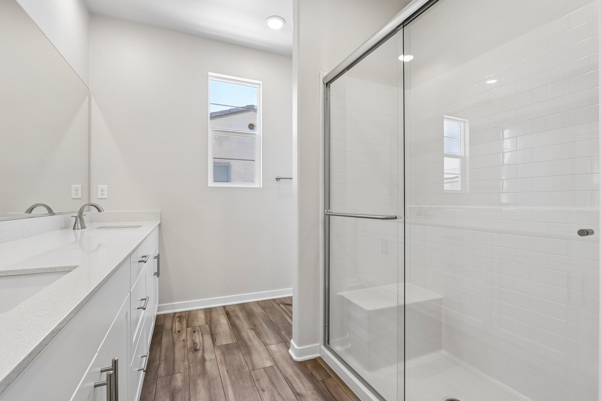 A bathroom with a glass shower.