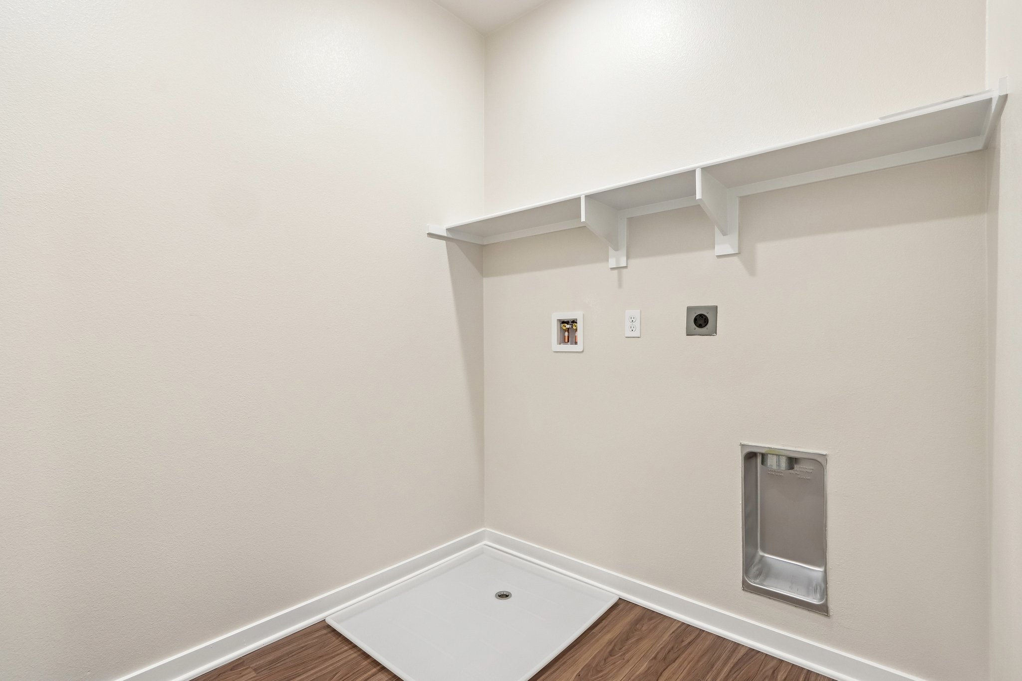 A white room with a white wall and a white ceiling.