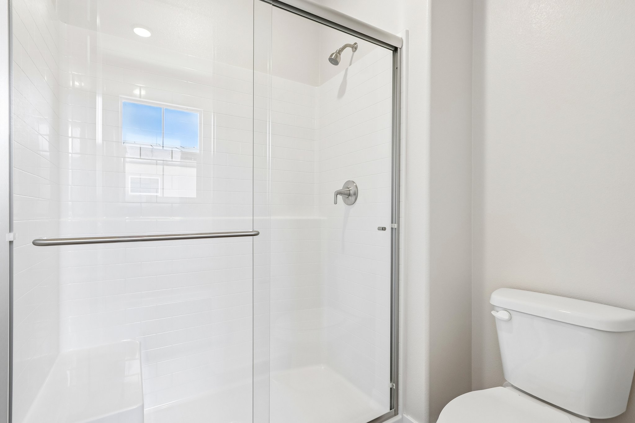 A bathroom with a glass shower.