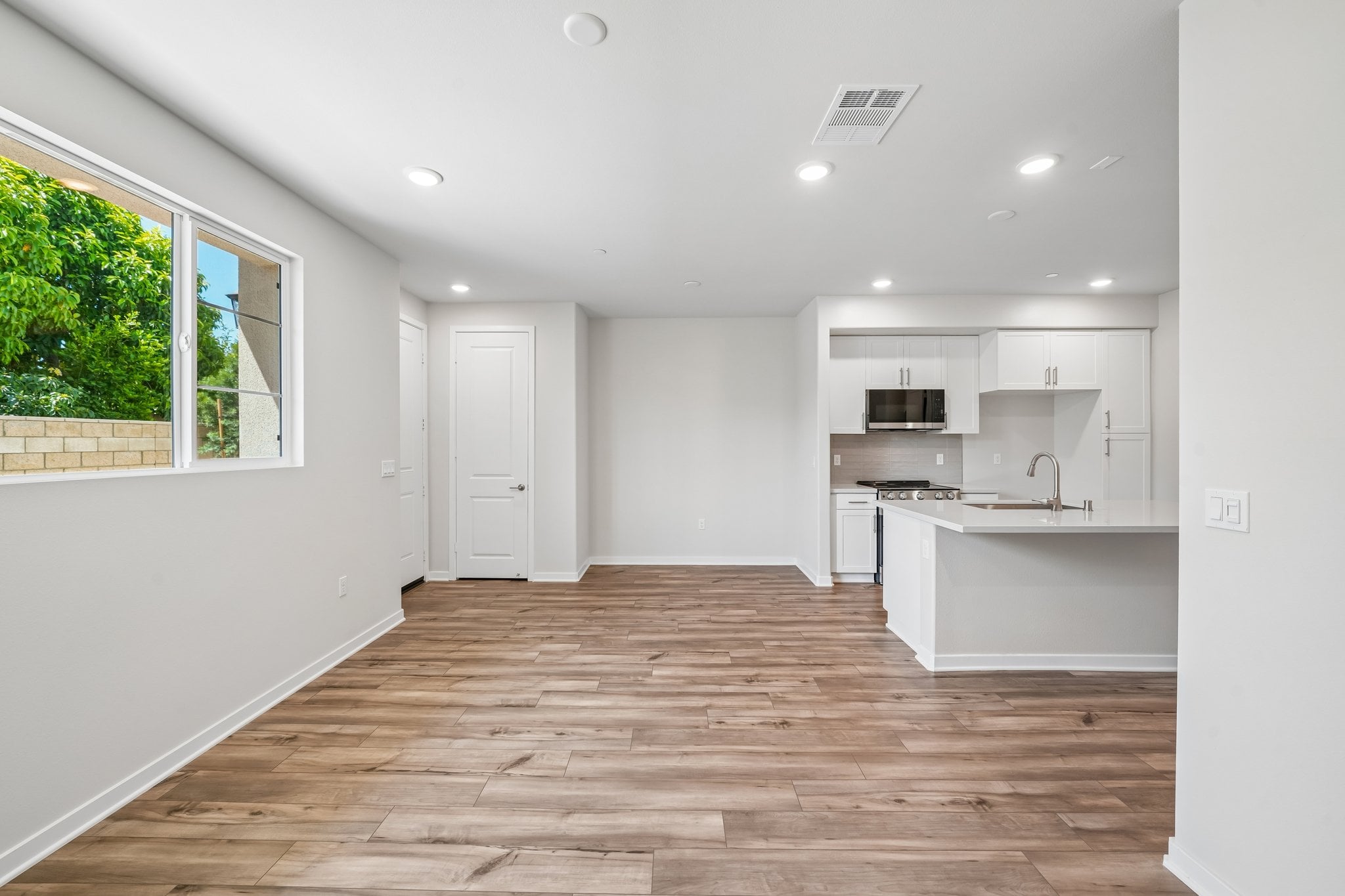 A kitchen with white walls.