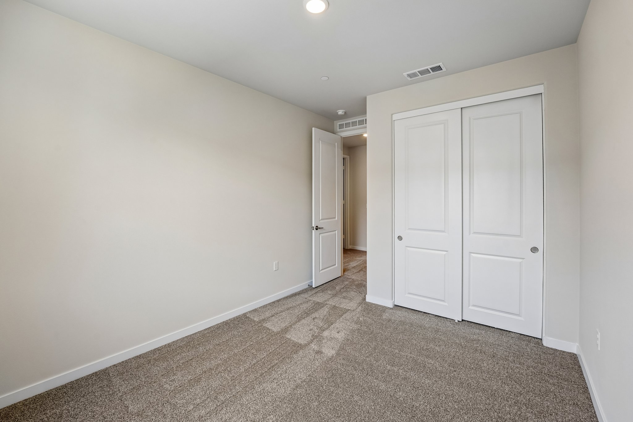 A room with white doors.