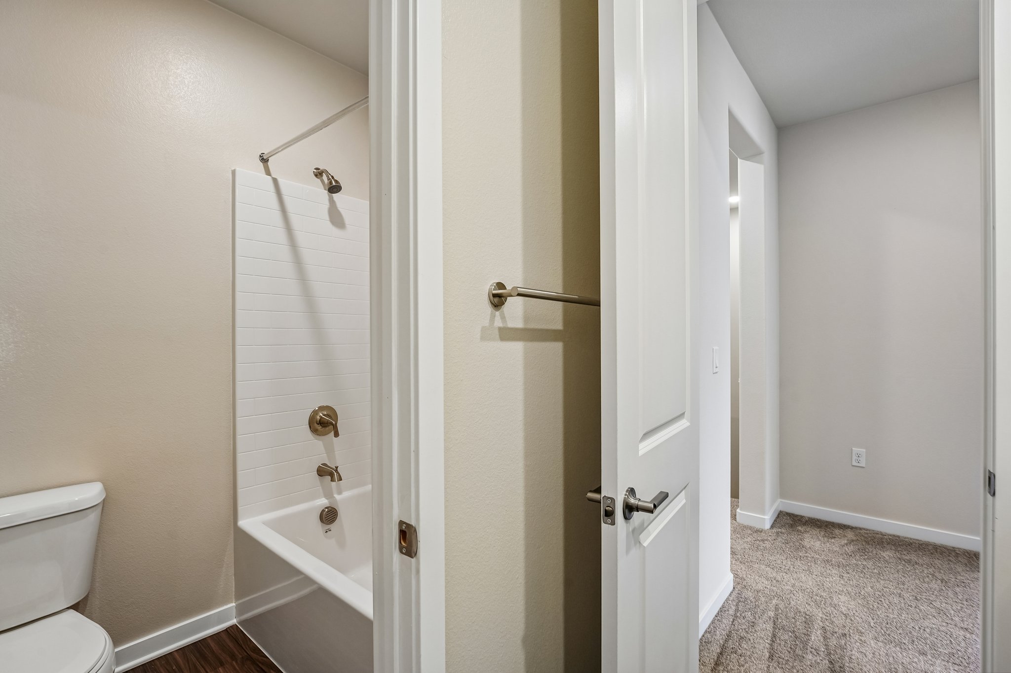 A bathroom with a shower unit.