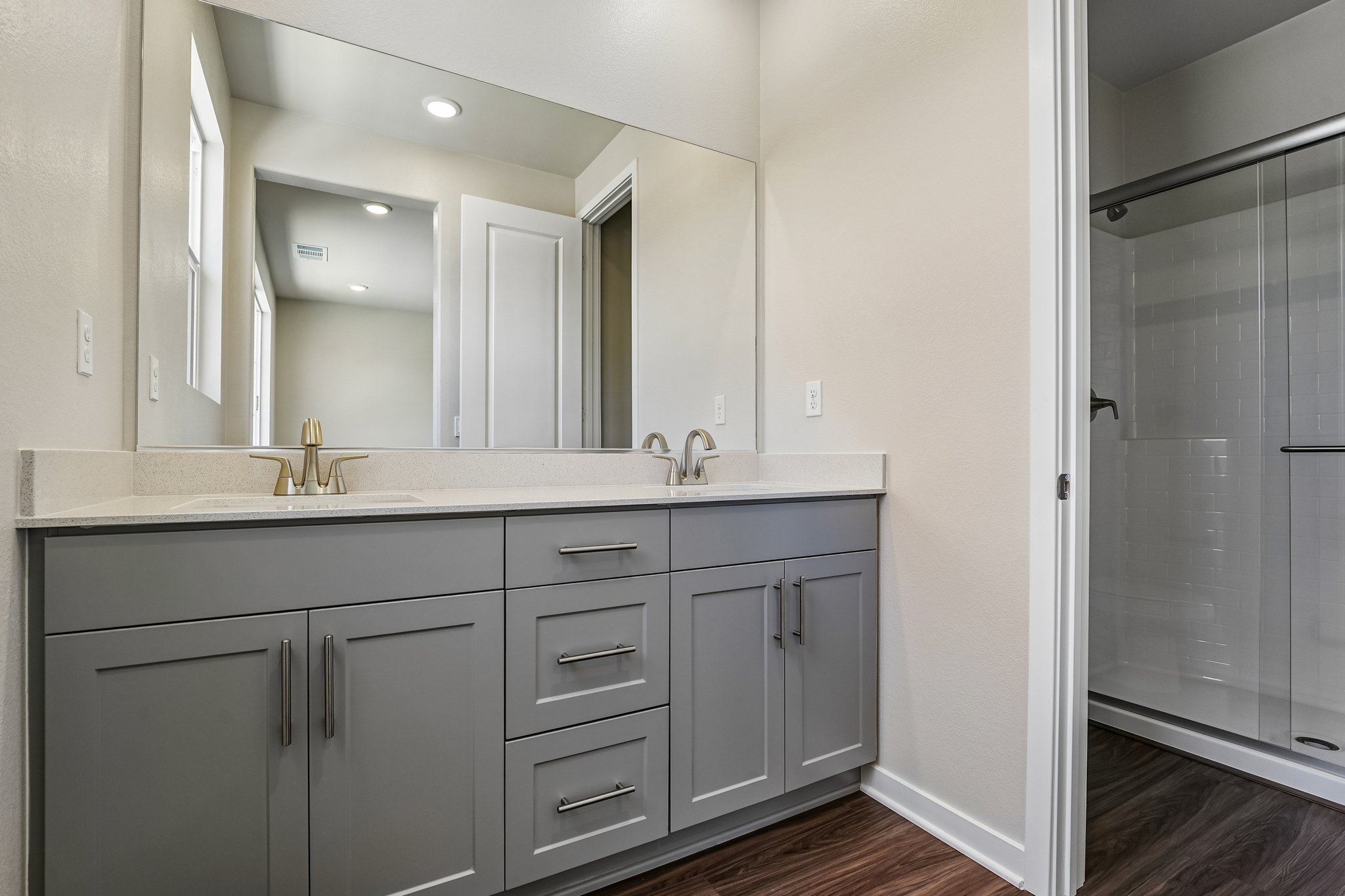 A bathroom with a glass shower.