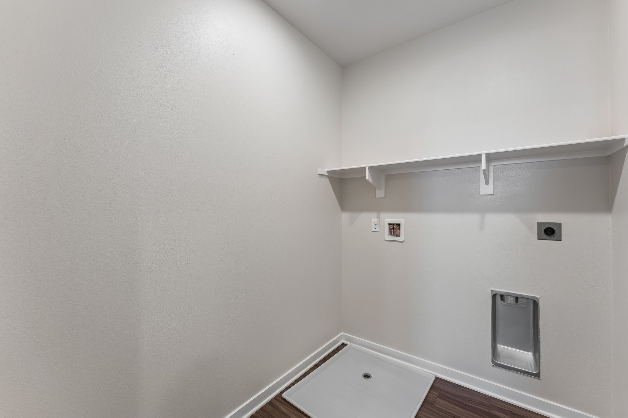 A white room with a white wall.