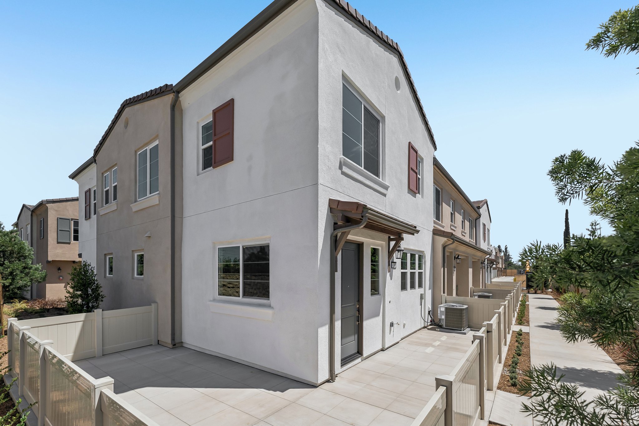A white building with a walkway.