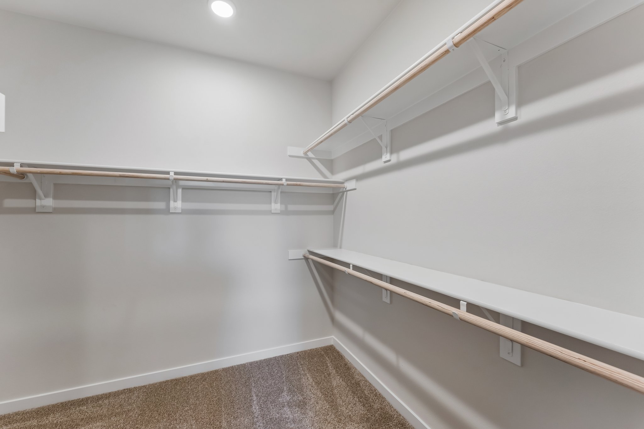 A white staircase in a room.