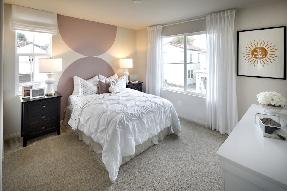 A bedroom with a large bed.