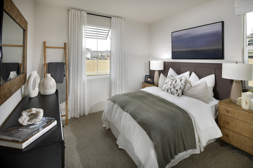 A bedroom with a bed and a tv.