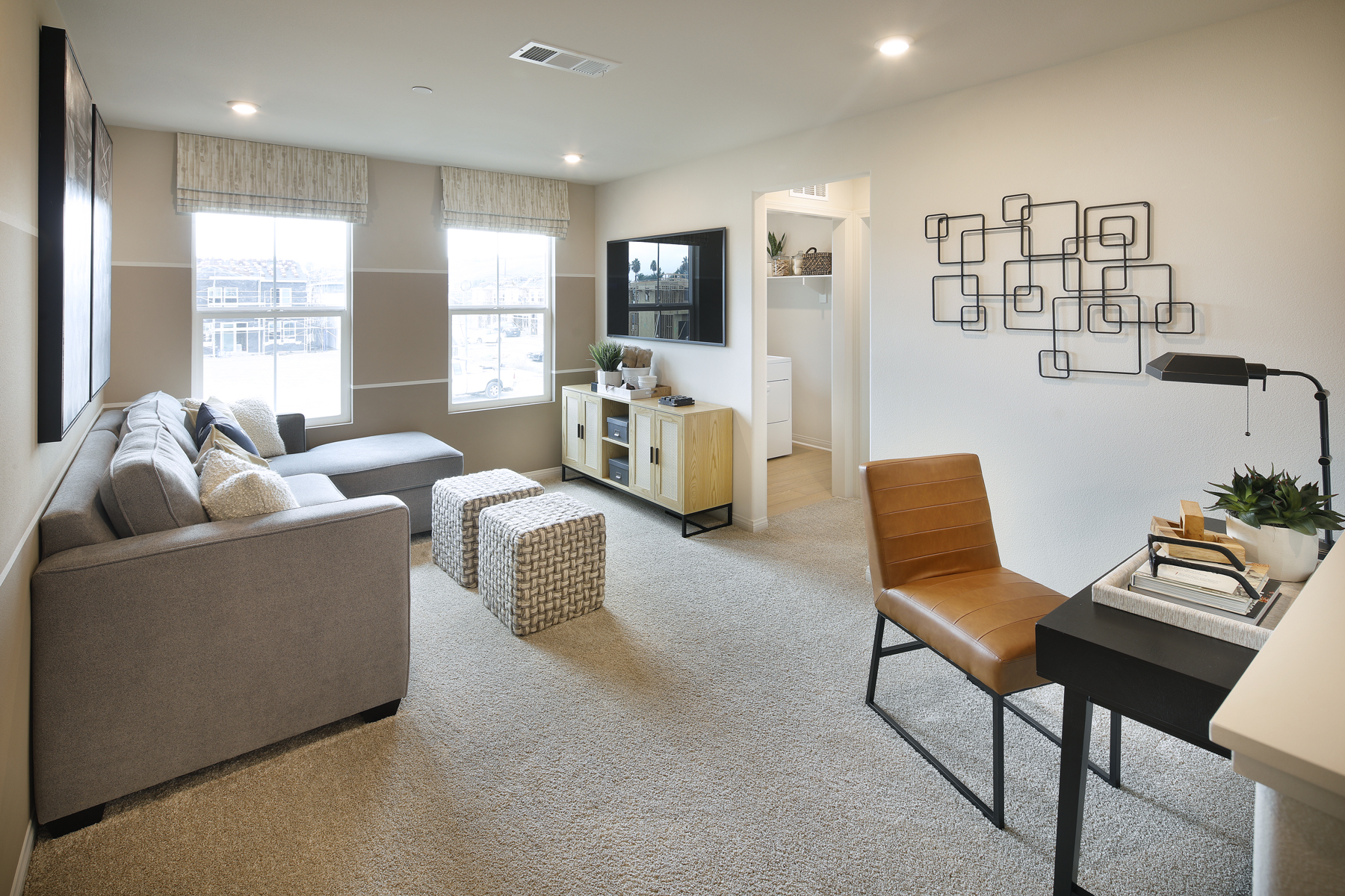 A living room with a couch and a tv.