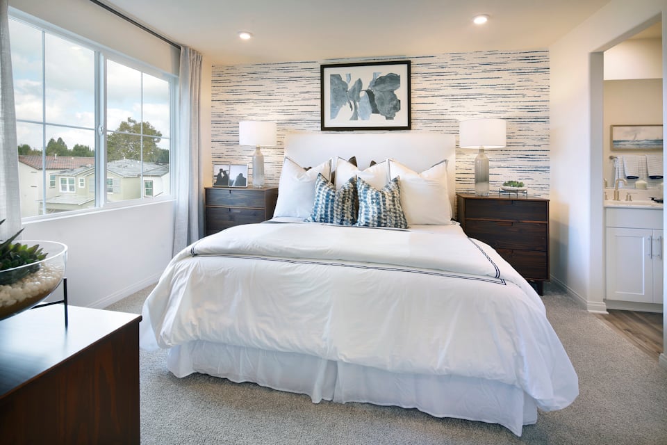 A bedroom with a large bed.