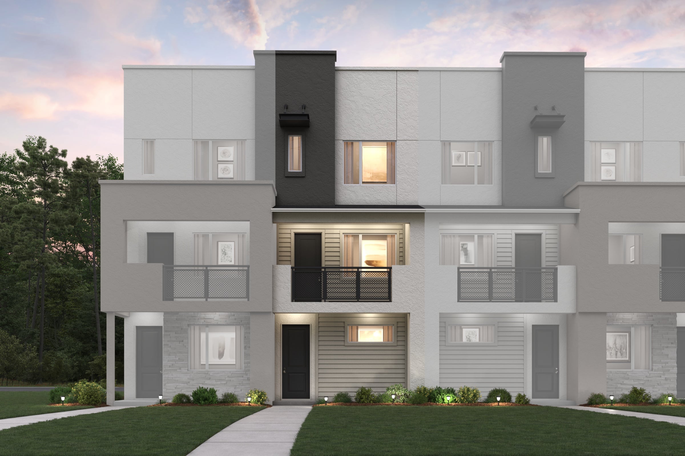 A grey house with a green lawn.