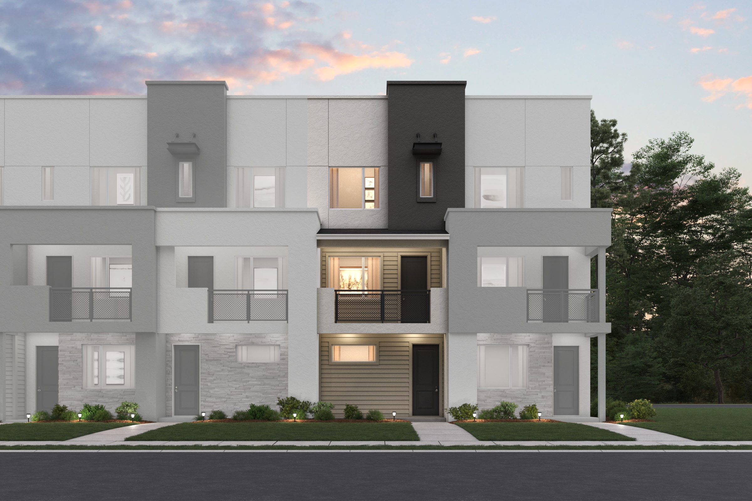 A grey building with a driveway.