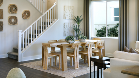 A living room with a staircase.