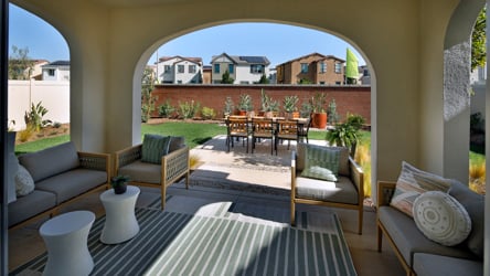 A patio with a table and chairs.
