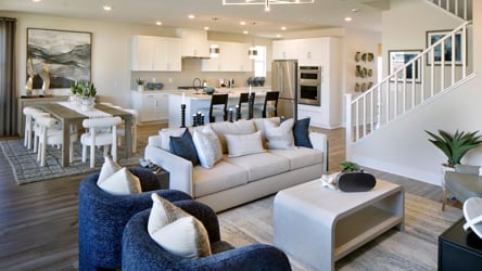 A living room with a couch and a table.