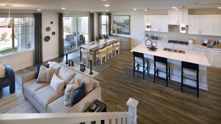 A large living room with a large kitchen and dining area.