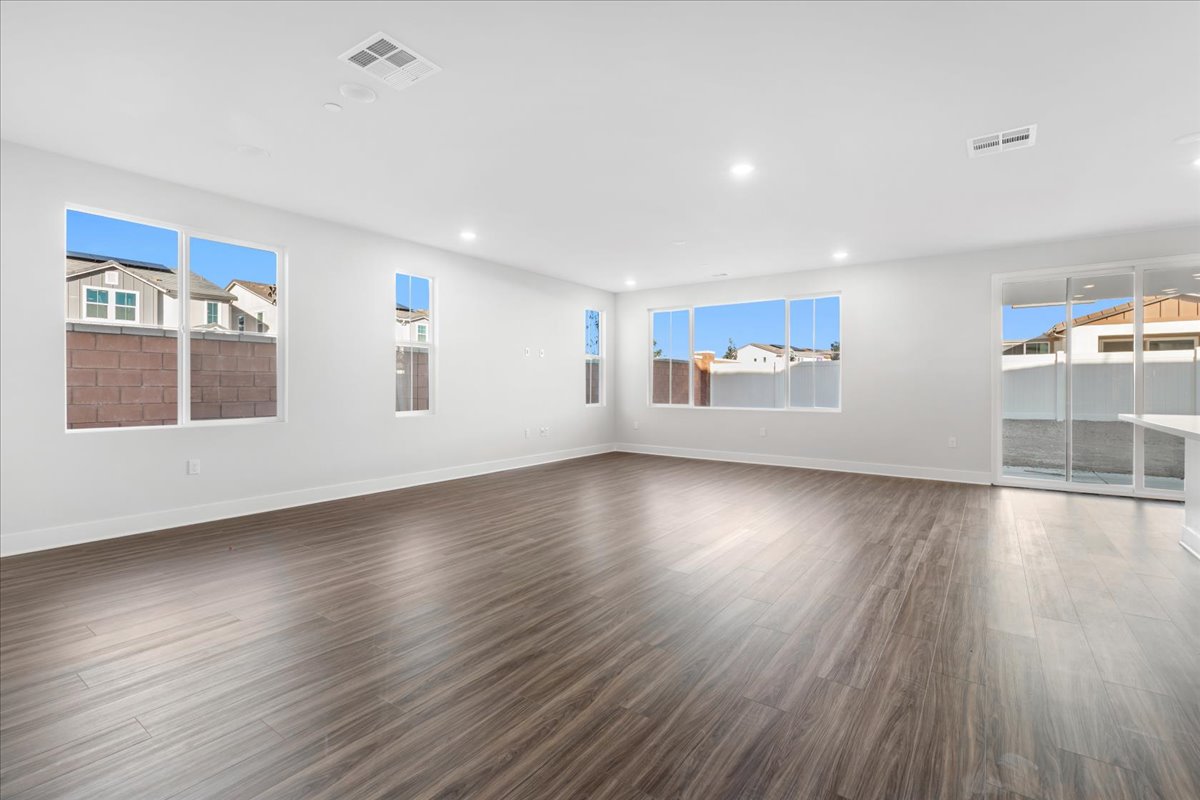 A large empty room with windows.