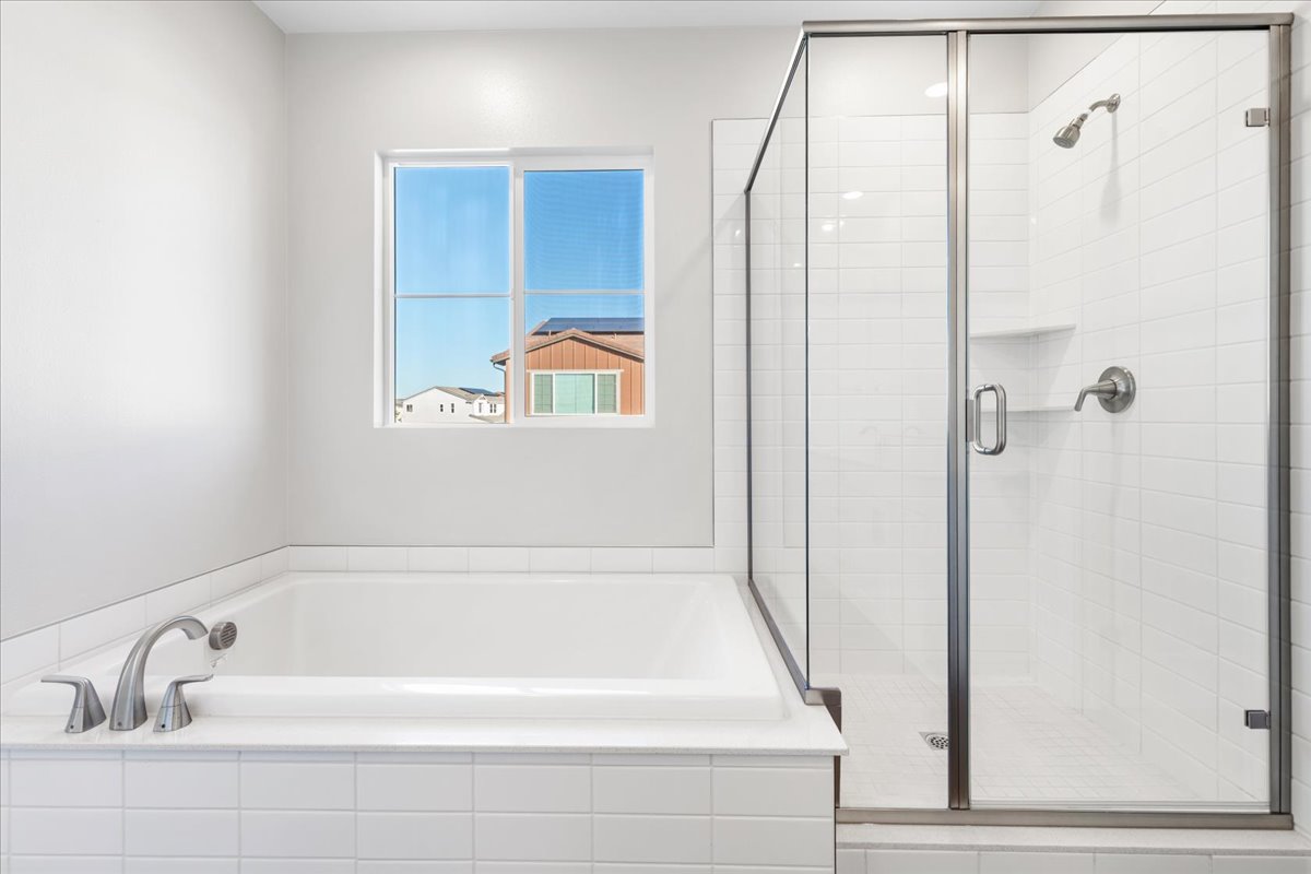 A bathroom with a glass shower.