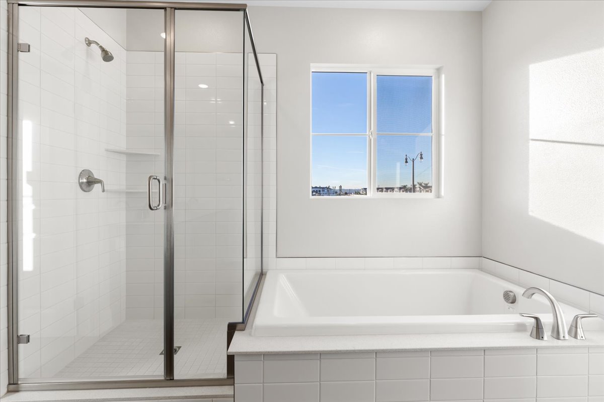 A bathroom with a glass shower.