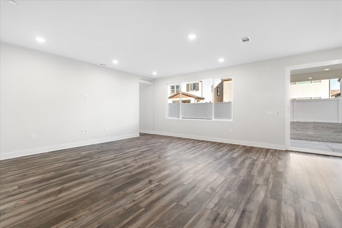 A room with a wood floor and a wood floor.