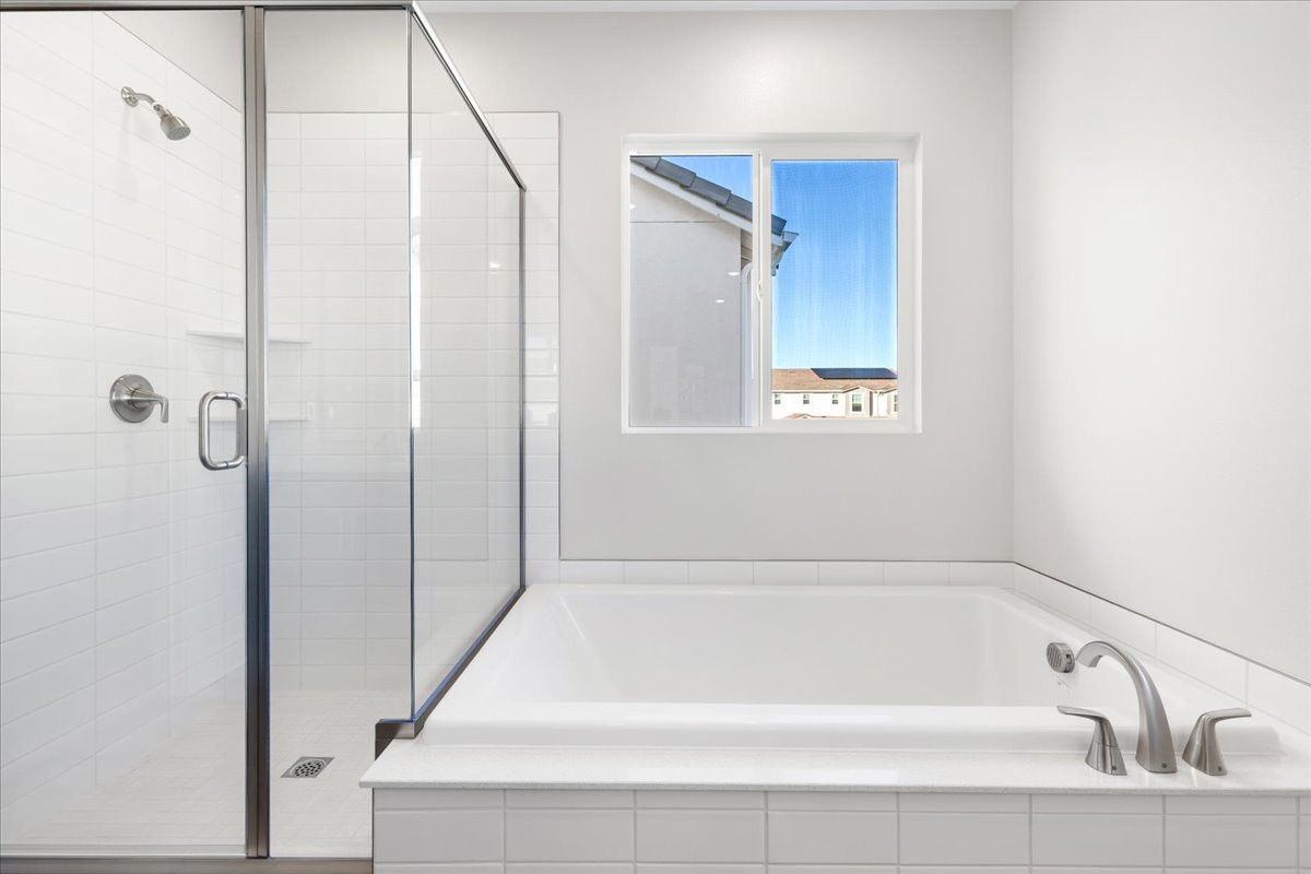 A bathroom with a glass shower.