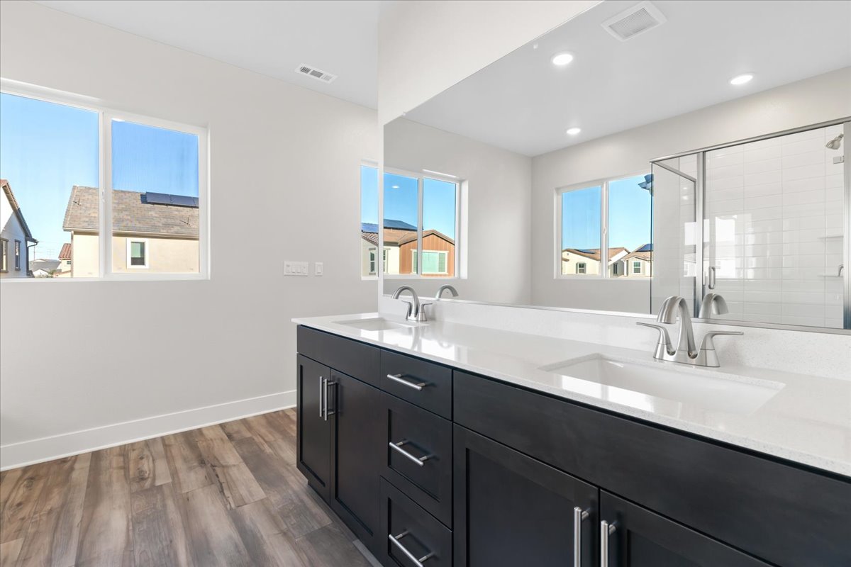 A bathroom with a large mirror.