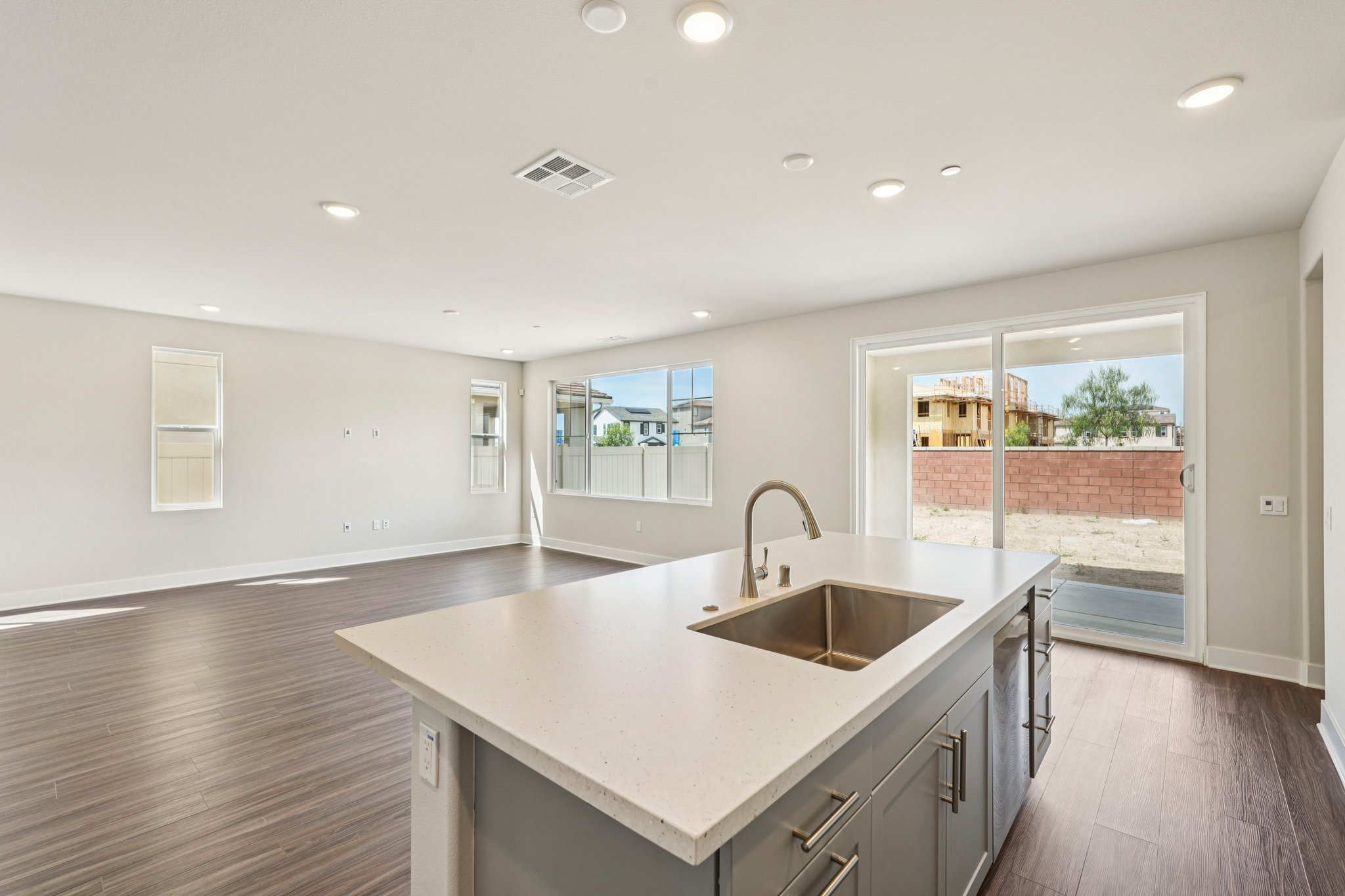 A kitchen with a sink and a window.