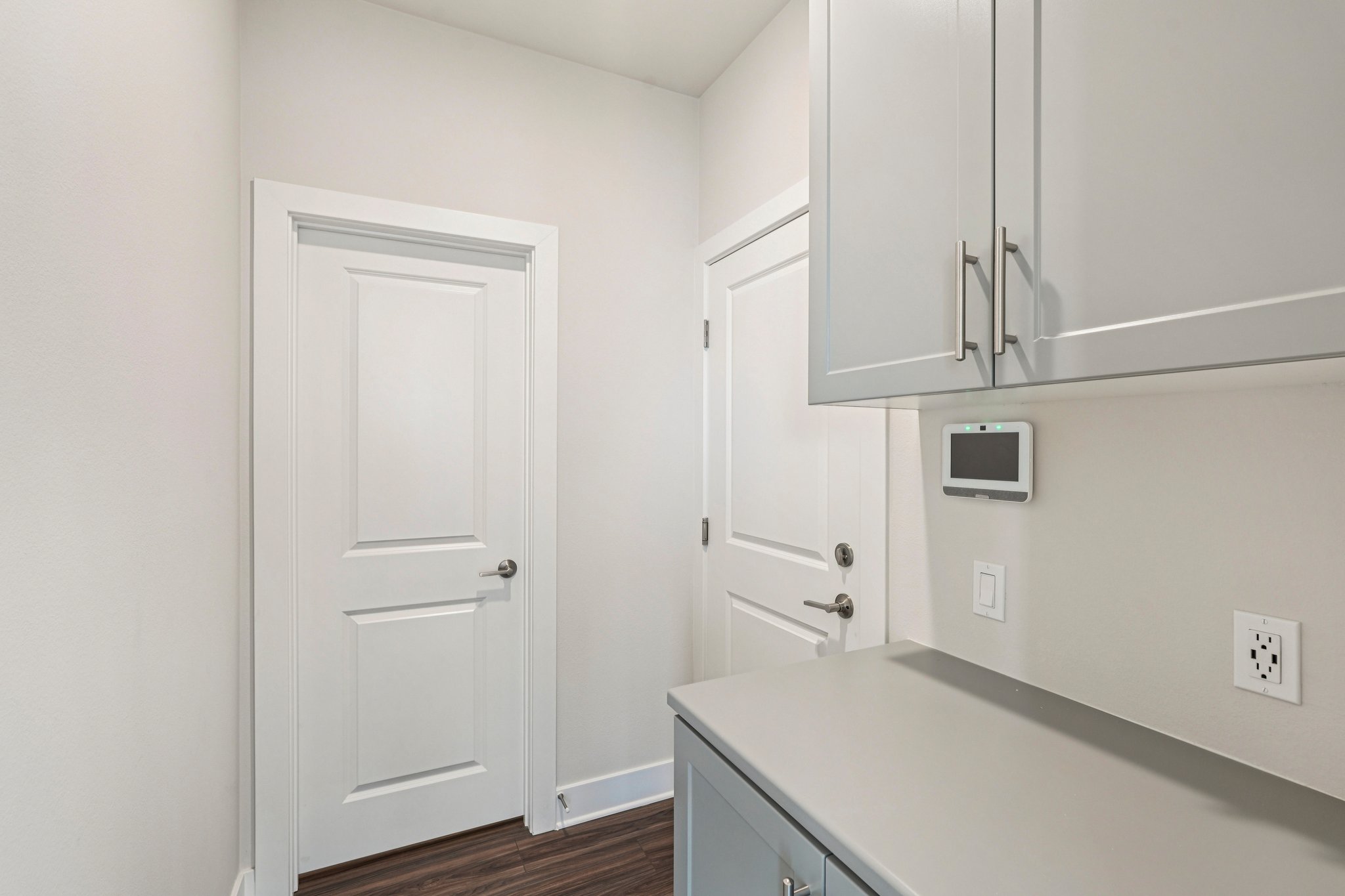 A white kitchen with white cabinets.