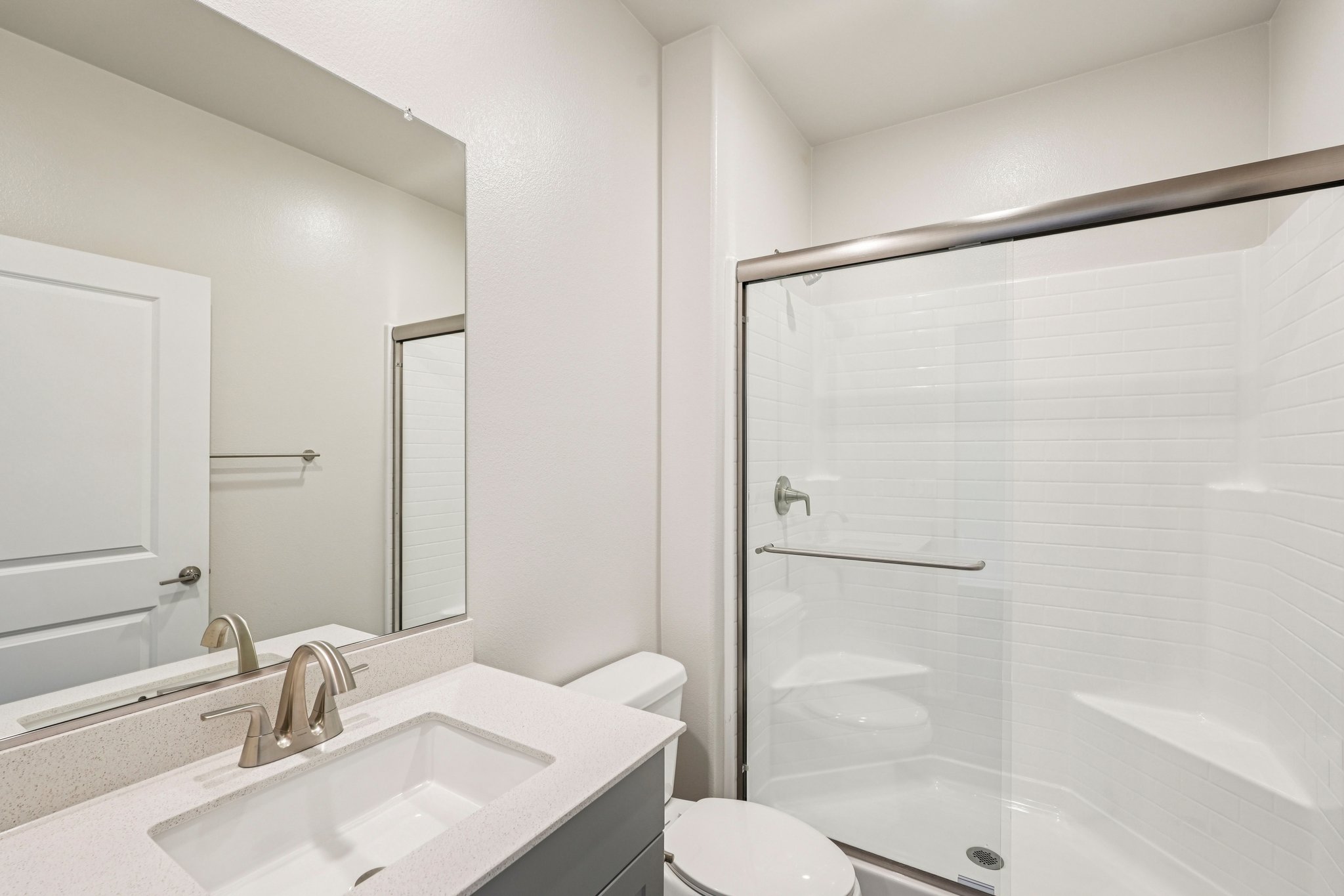 A bathroom with a glass shower.