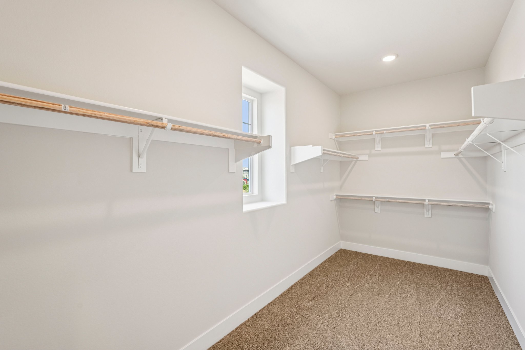 A white room with a staircase.