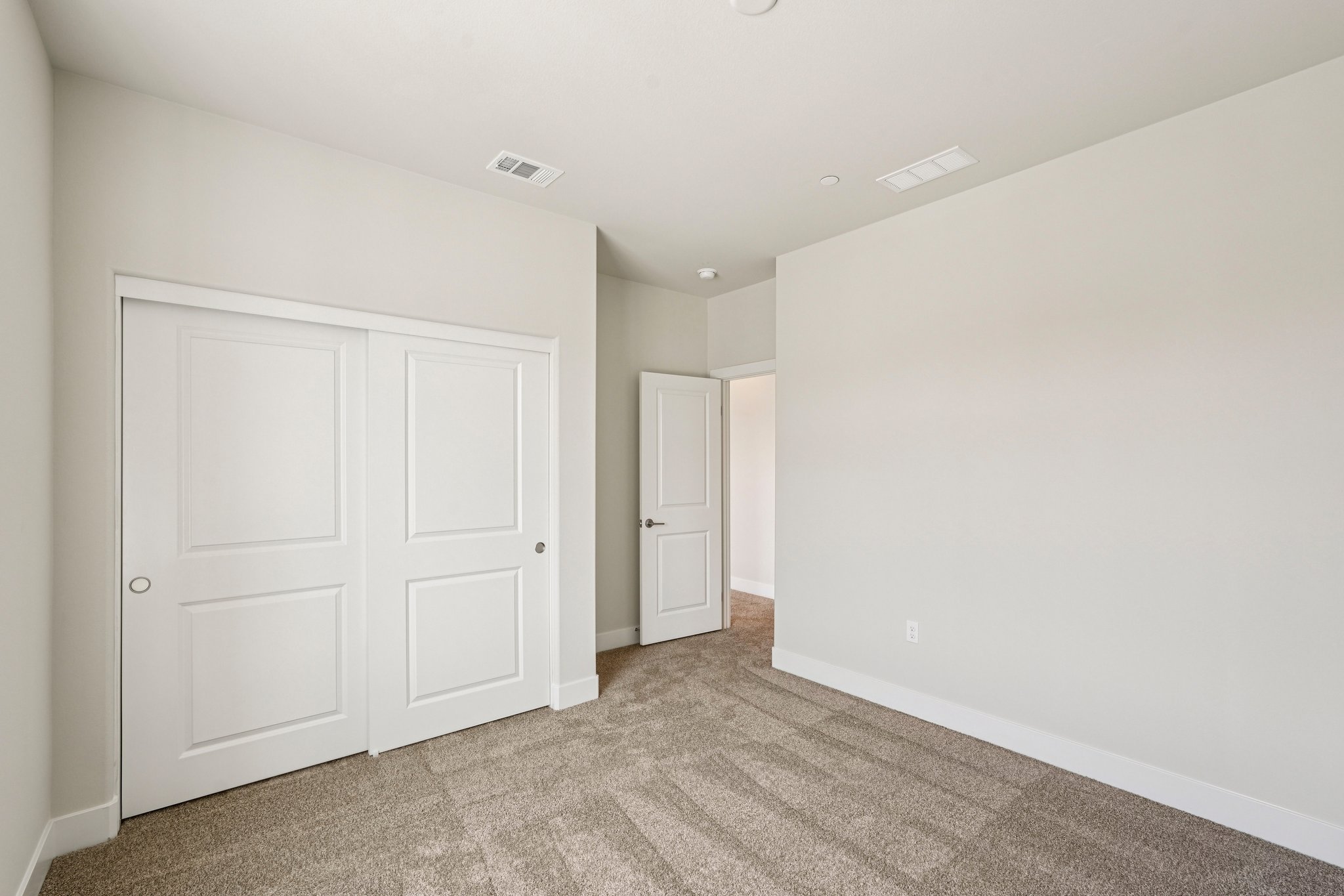 A room with white doors.