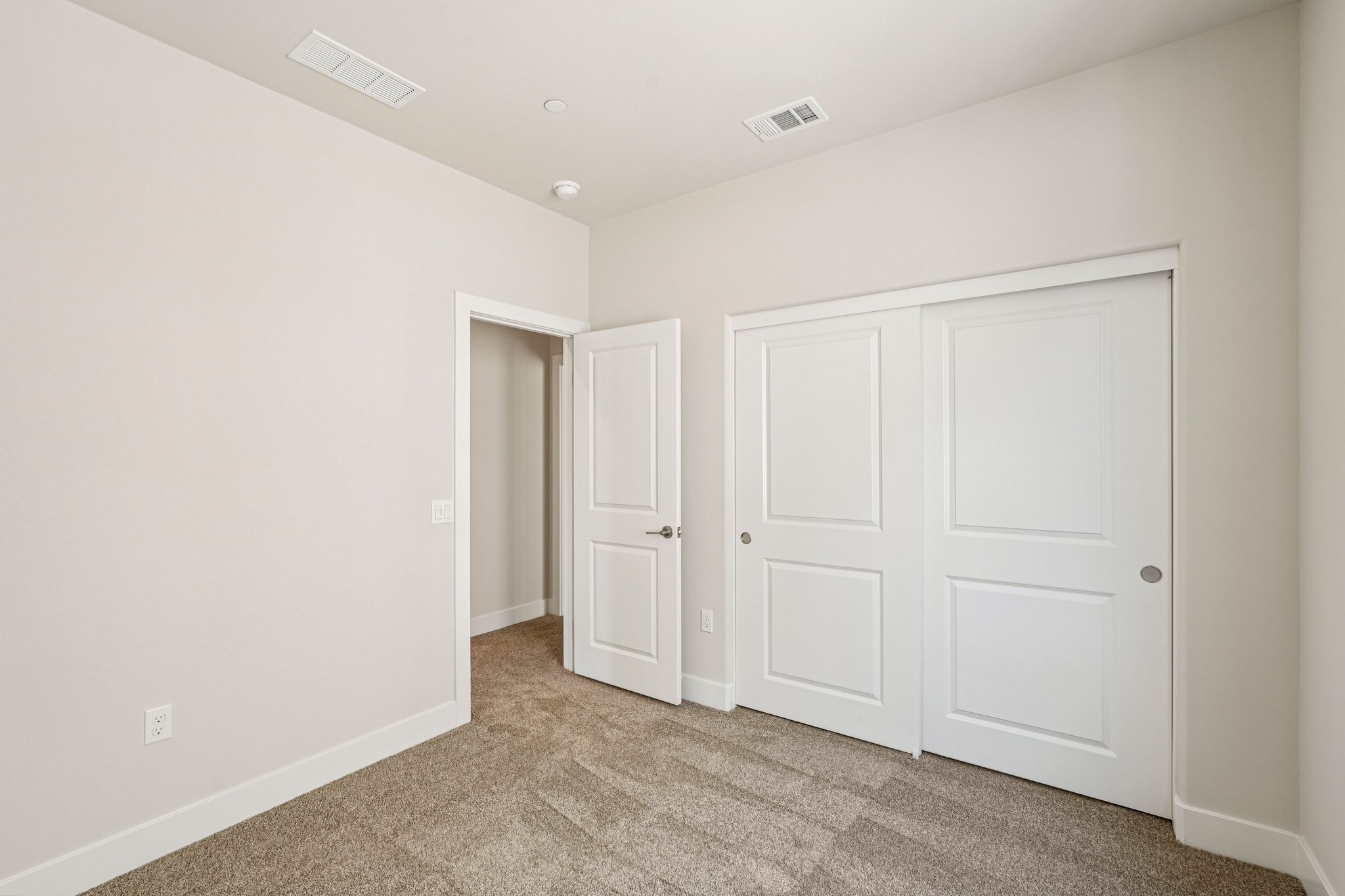 A room with white doors.