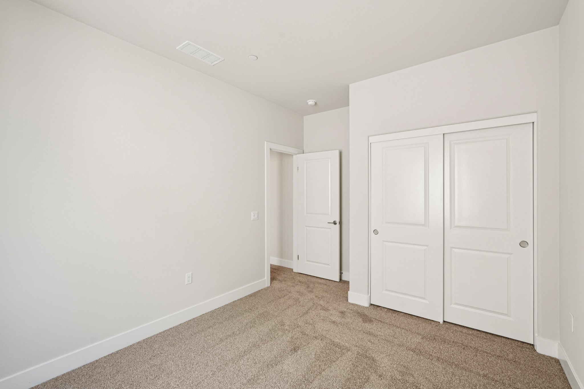 A room with white doors.