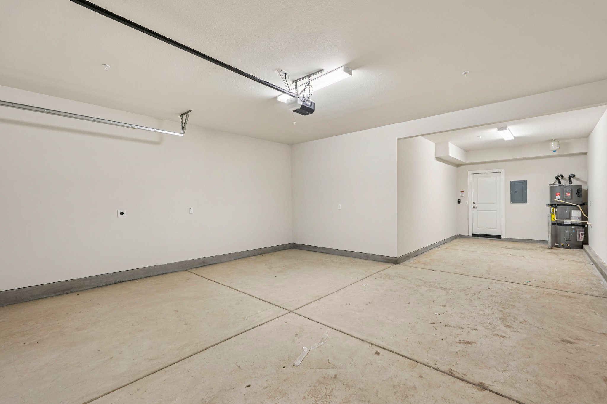 A room with white walls and a wood floor.
