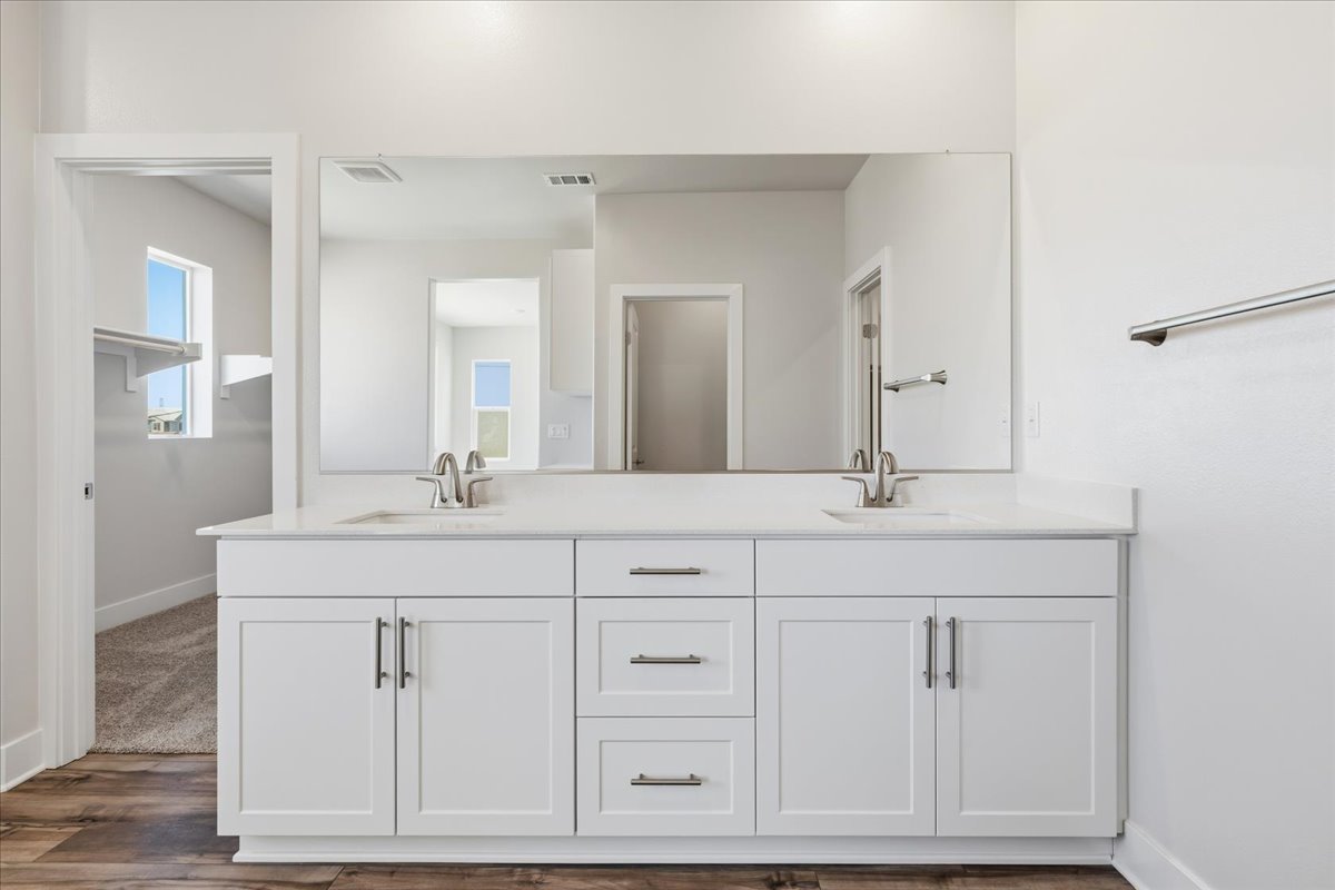 A white kitchen with white cabinets.