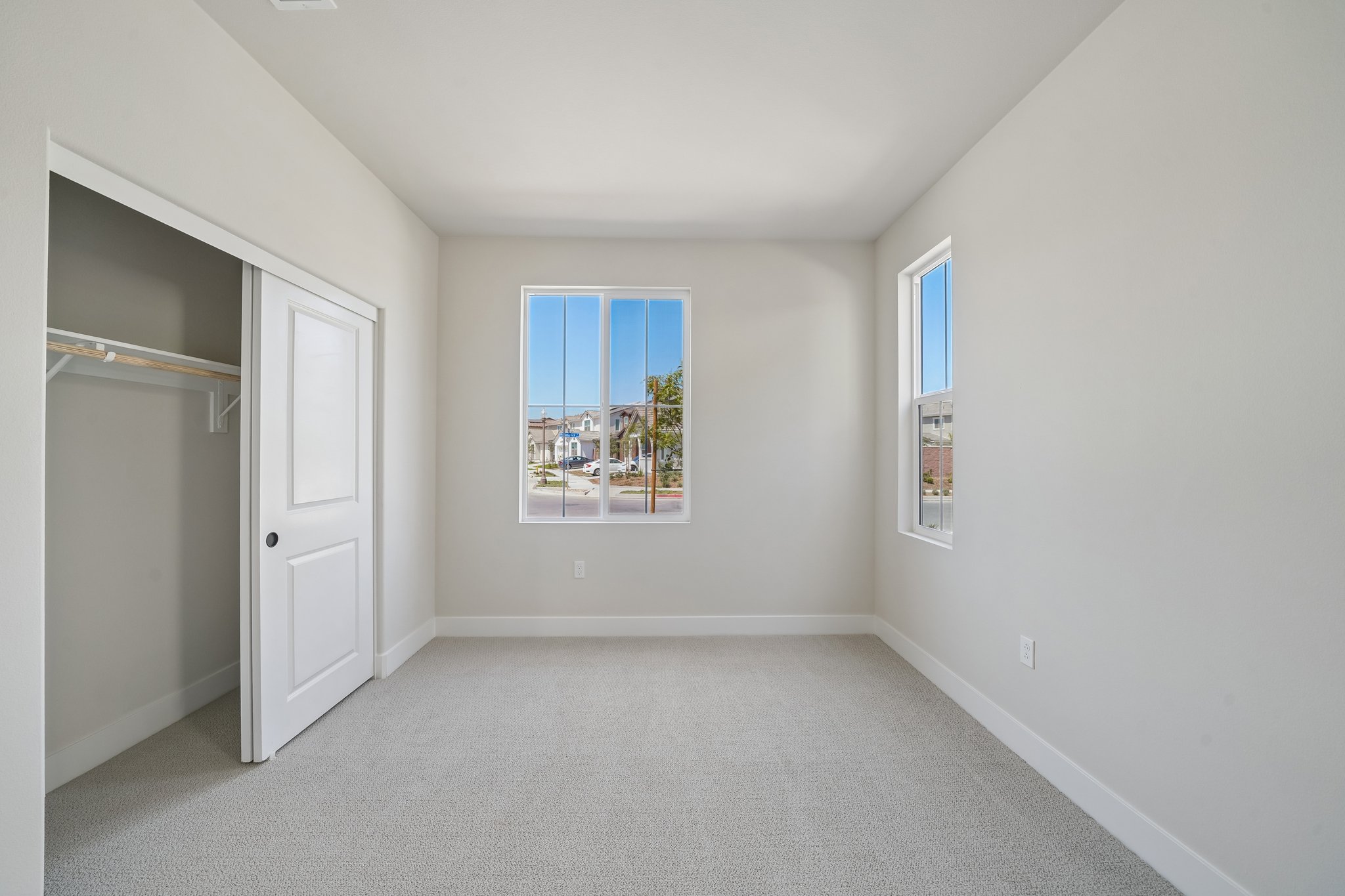 A room with a window and a door.