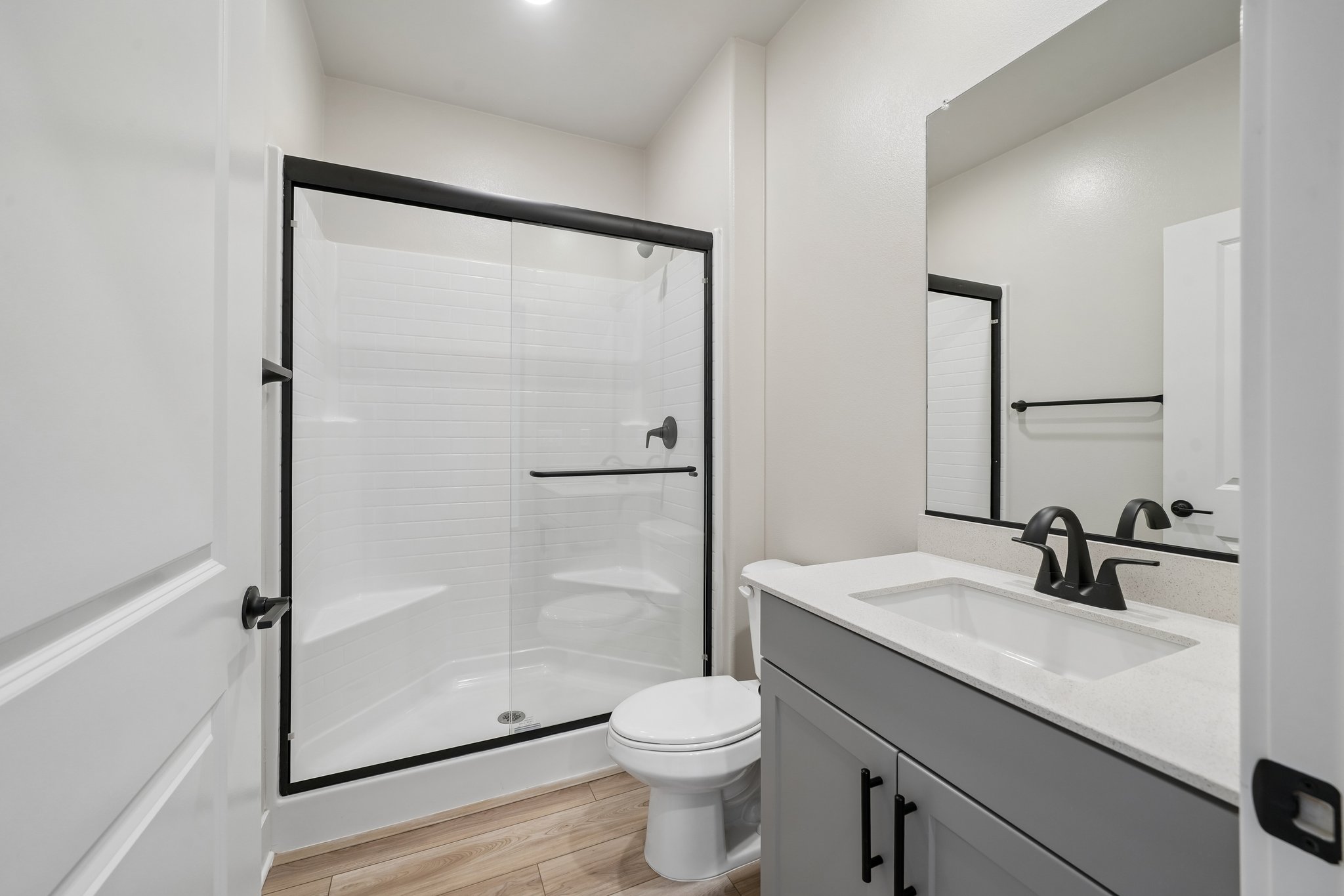 A bathroom with a glass shower.