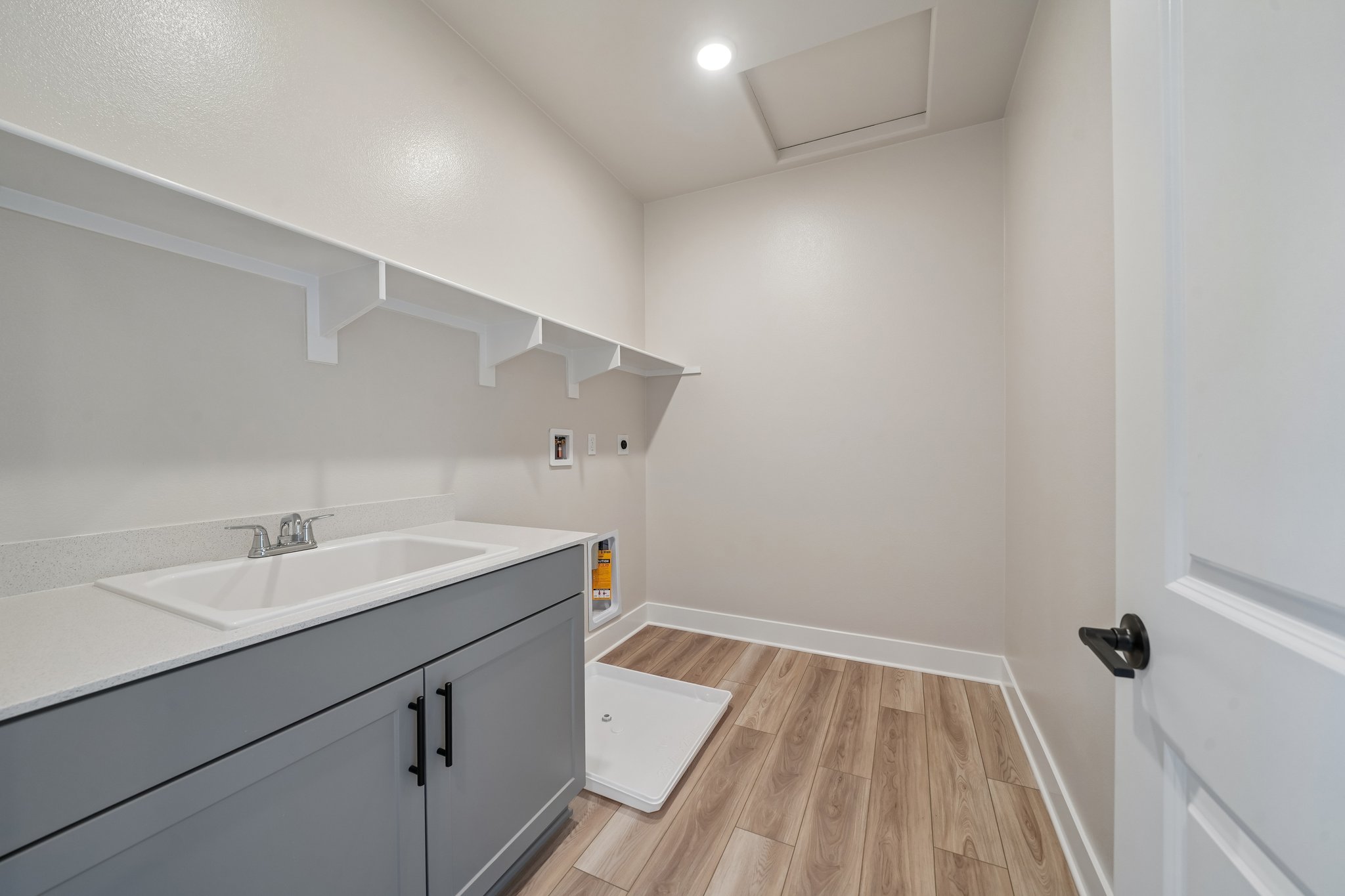 A bathroom with white walls.