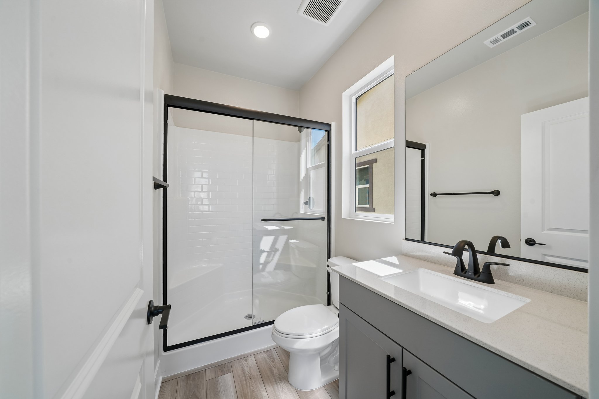 A bathroom with a glass shower.