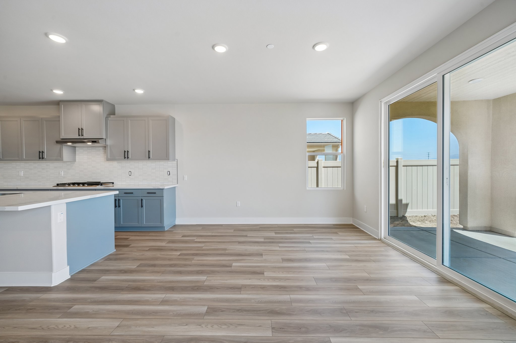 A kitchen with a wood floor.