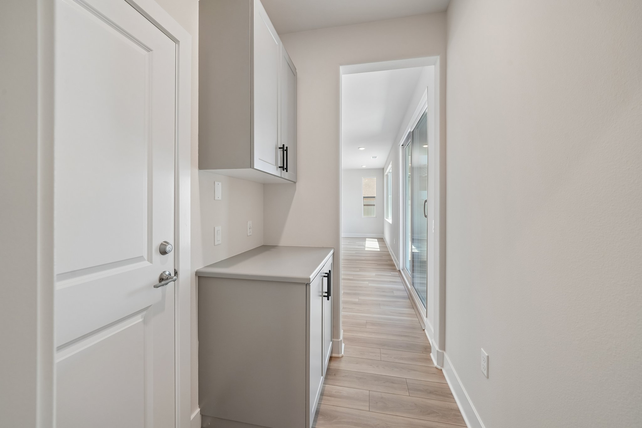 A hallway with white doors.