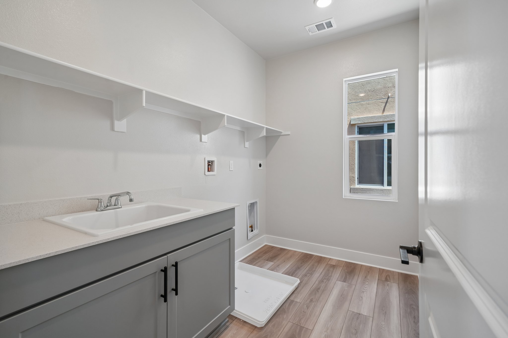A bathroom with a sink and a mirror.