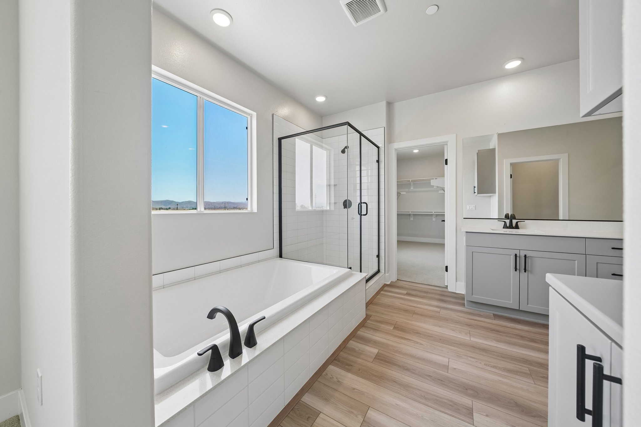 A bathroom with a tub and sink.