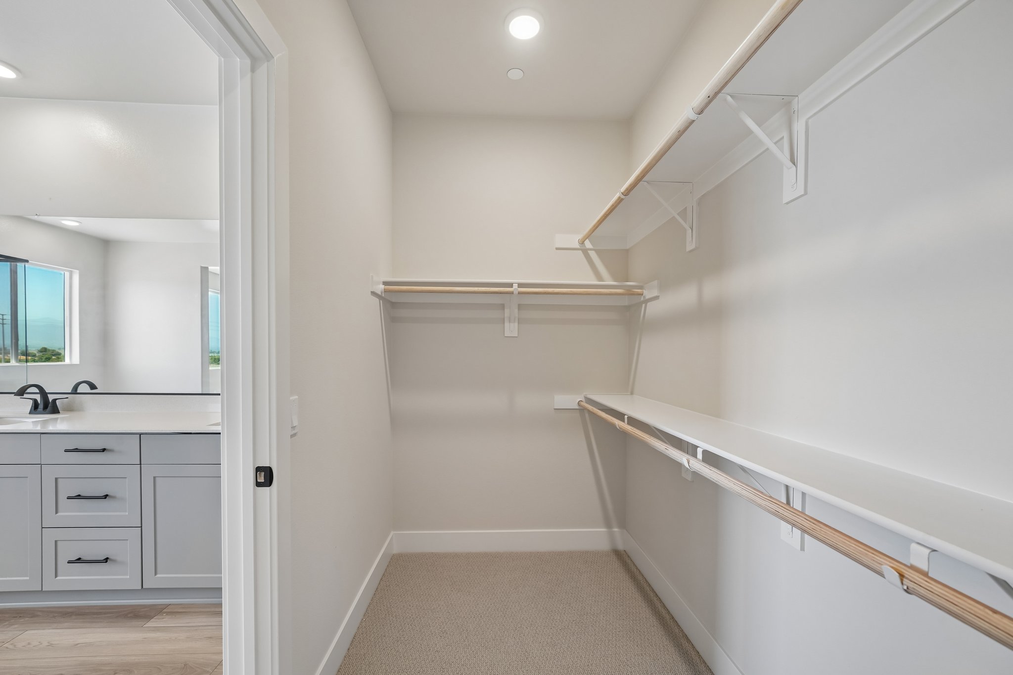 A white bathroom with a white staircase.