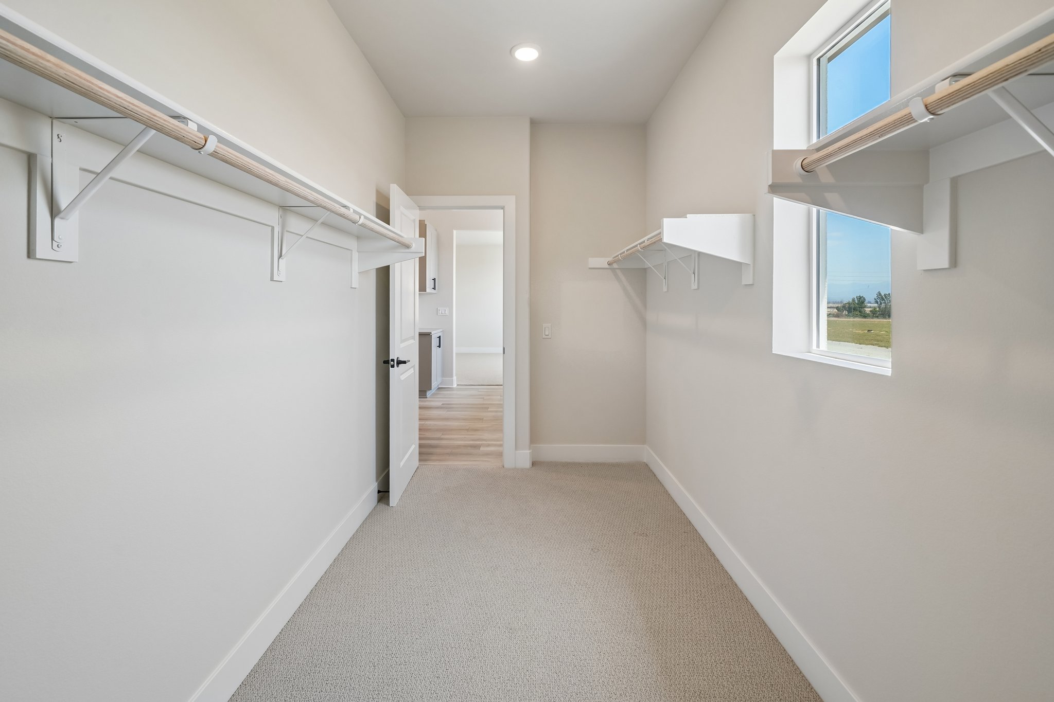 A hallway with white walls.