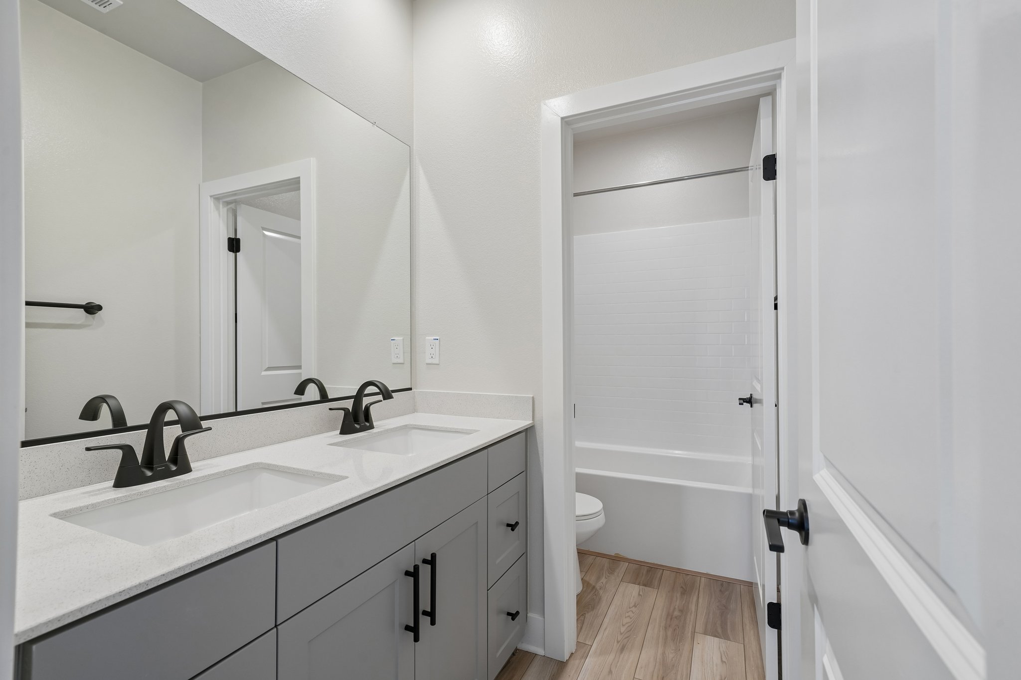 A bathroom with a sink and a toilet.